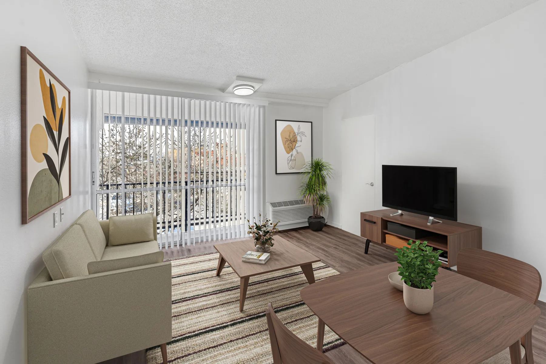 Furnished living and dining area with wood-style flooring at ABQ Encore Apartments